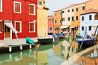 Houses and boats reflected in the water in Venice, Italy Houses and boats reflected in the water in Venice, Italy