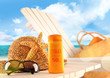 Sunblock lotion and beach items on table Sunblock lotion and beach items on table