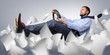 Foto: Businessman driver flying through the expanding white paper Businessman driver flying through the expanding white paper