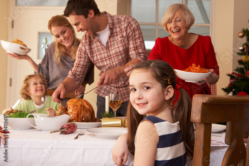 Photo: Family serving Christmas dinner Family serving Christmas dinner