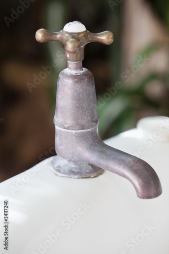 Photo: Close-up of a brass faucet Close-up of a brass faucet