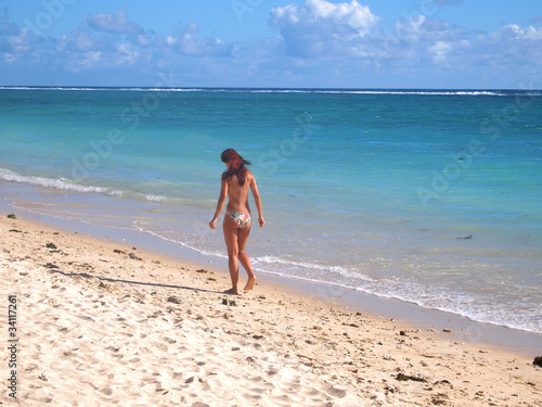 Photo: Sexy, semi naked woman at the beach Sexy, semi naked woman at the beach