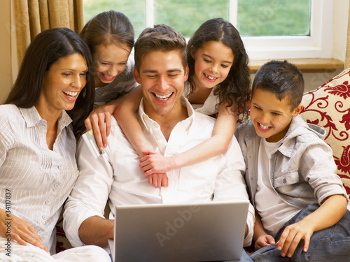 Photo: Hispanic family shopping online Hispanic family shopping online