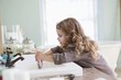 Cute little girl brushing teeth at bathroom sink
