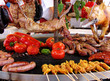 rabbit, meat and vegetables in course of barbecue preparation at