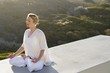 Mid adult woman meditating