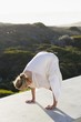 Mid adult woman practicing yoga