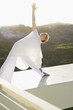 Mid adult woman stretching her arms