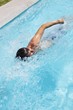 Man doing front crawl in swimming pool