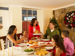 Photo: Hispanic family serving Christmas dinner Hispanic family serving Christmas dinner