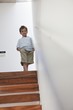 Boy standing on a staircase
