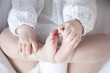 baby holding little feet
