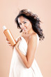 Photo: Cute hispanic young woman ready to take care of her hair Cute hispanic young woman ready to take care of her hair