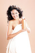Photo: Cute hispanic young woman ready to take care of her hair Cute hispanic young woman ready to take care of her hair