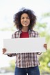 Woman holding a blank placard