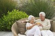 Senior couple toasting with wine glasses