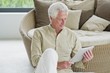 Senior man holding a digital tablet