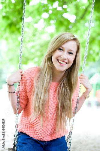 Photo: Young woman on swing Young woman on swing