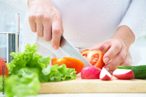 Photo: Hands cooking vegetables salad Hands cooking vegetables salad