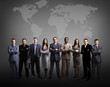 Businessmen standing in front of an earth map