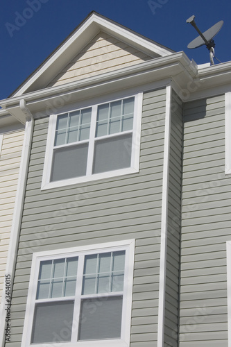 Photo: Detail of newly build townhome with a satellite dish Detail of newly build townhome with a satellite dish