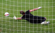 Soccer football goalkeeper making diving save