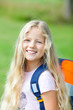 girl outdoor with school bag go to school  smiling