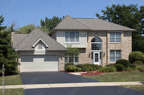 Photo: Brick home with arched front windows Brick home with arched front windows