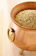 raw quinoa on copper pot