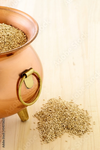 Photo: raw quinoa on copper pot raw quinoa on copper pot
