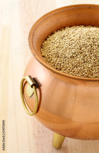 Photo: raw quinoa on copper pot raw quinoa on copper pot