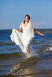 Photo: bride in sea waves bride in sea waves