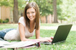 A pretty young college student with study materials A pretty young college student with study materials