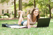 A pretty young college student with study materials A pretty young college student with study materials