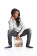 Black teenage student girl sits on education books