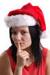 Foto: eine junge Frau trägt eine Weihnachtsmütze eine junge Frau trägt eine Weihnachtsmütze