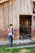 Patriotic boy and old barn Patriotic boy and old barn