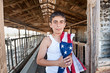 Patriotic boy in old barn Patriotic boy in old barn