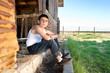 Boy sitting in barn Boy sitting in barn