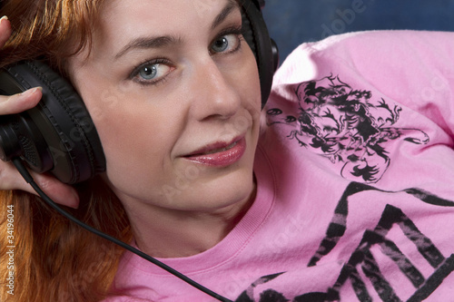 Photo: Blue Eyed Woman with Headphones Blue Eyed Woman with Headphones