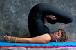 Photo: portrait of woman doing yoga asana shoulder stand lotus pose portrait of woman doing yoga asana shoulder stand lotus pose