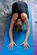 Photo: young woman doing yoga asana Balasana or childs pose young woman doing yoga asana Balasana or childs pose