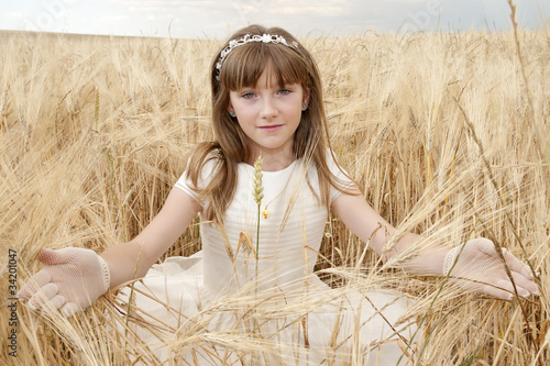 Photo: girl wearing first communion dress girl wearing first communion dress