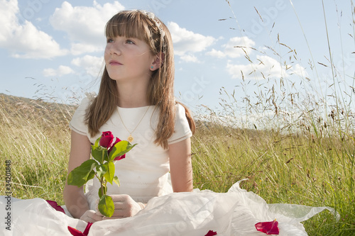 Photo: girl wearing first communion dress in the meadow girl wearing first communion dress in the meadow