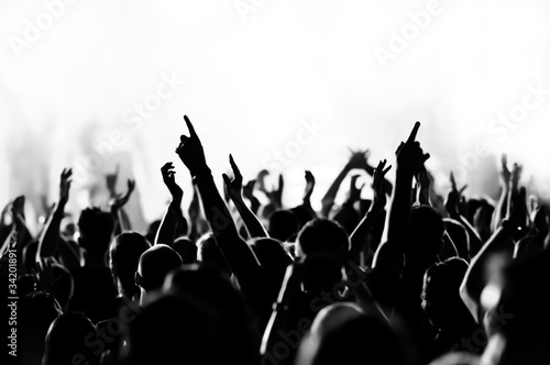 Photo: concert crowd in front of bright blue stage lights concert crowd in front of bright blue stage lights