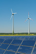 Windkrafträder und Solarmodule vor einem Rapsfeld Windkrafträder und Solarmodule vor einem Rapsfeld