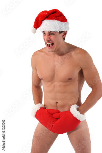 Photo: Sexy muscular man screams wearing a Santa Claus hat Sexy muscular man screams wearing a Santa Claus hat