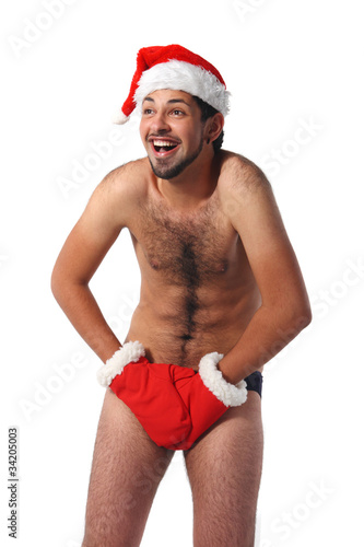 Photo: Sexy muscular man screams wearing a Santa Claus hat Sexy muscular man screams wearing a Santa Claus hat