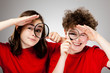 Girl and boy holding magnifying glass Girl and boy holding magnifying glass