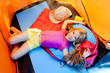 Children girl lying on camping tent floor in vacation